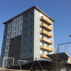 a tall building with balconies on the side of it at The Residence Galliate in Galliate