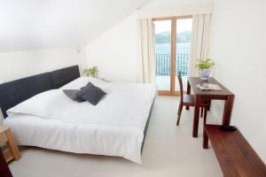 Posteľ alebo postele v izbe v ubytovaní Eol Apartments Viganj
