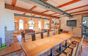 a living room with a large wooden table and chairs at Ferienhaus Viereck in Viereck