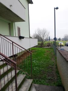 a group of stairs next to a building at bilocale con giardino in Zibido al Lambro