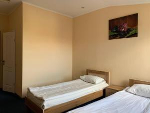 Postel nebo postele na pokoji v ubytování Budget Hotel Ekotel