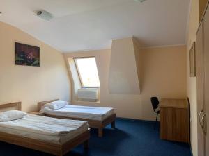 Postel nebo postele na pokoji v ubytování Budget Hotel Ekotel