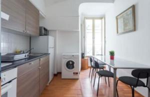 a kitchen with a table and chairs in a room at D116 Home - Your Perfect Place in Naples