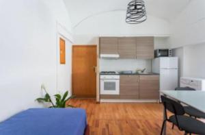 a living room with a kitchen and a dining room at D116 Home - Your Perfect Place in Naples +27 photos