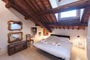 En eller flere senge i et værelse på Casa Gep - Ponte San Michele