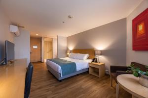 Voodi või voodid majutusasutuse Hotel Estelar Blue toas