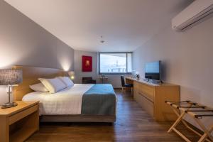 Postel nebo postele na pokoji v ubytování Hotel Estelar Blue