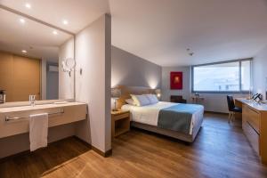 Voodi või voodid majutusasutuse Hotel Estelar Blue toas