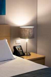 Voodi või voodid majutusasutuse Hotel Estelar Blue toas