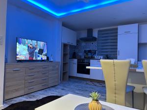 TV a/nebo společenská místnost v ubytování Appart Chez willi