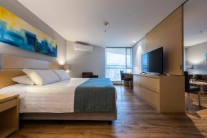 Voodi või voodid majutusasutuse Hotel Estelar Blue toas