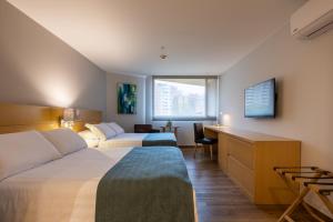 Voodi või voodid majutusasutuse Hotel Estelar Blue toas
