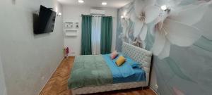 Postel nebo postele na pokoji v ubytování Venera Lux Apartman