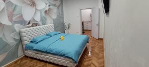 Postel nebo postele na pokoji v ubytování Venera Lux Apartman