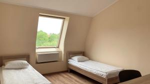 Postel nebo postele na pokoji v ubytování Budget Hotel Ekotel