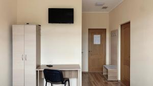 TV a/nebo společenská místnost v ubytování Budget Hotel Ekotel