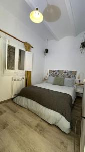 Katil atau katil-katil dalam bilik di Habitación El Patufet en Casa Camí de les Aigües Monistrol de Montserrat