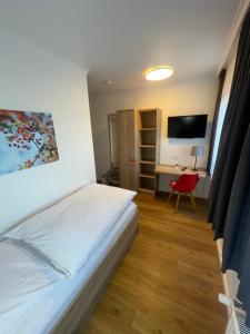 Postel nebo postele na pokoji v ubytování Gasthaus Sonnen