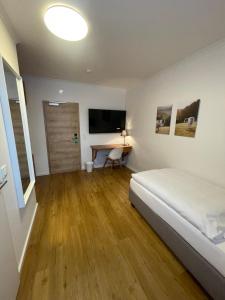 Postel nebo postele na pokoji v ubytování Gasthaus Sonnen