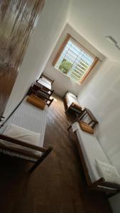 Postel nebo postele na pokoji v ubytování Brumas Ouro Preto Hostel e Pousada