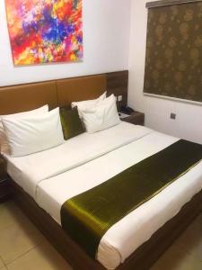 Kama o mga kama sa kuwarto sa Ringruby Hotel, Sangotedo