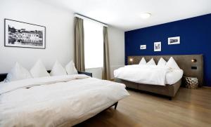Ένα ή περισσότερα κρεβάτια σε δωμάτιο στο Hotel Zugertor
