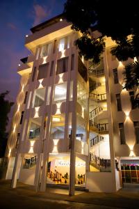 a large white building with lights on it at Heritage Grand - Badulla in Badulla
