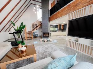 a living room with a large flat screen tv at Villa Bosanska Zvijezda in Vlasic