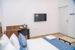 Kama o mga kama sa kuwarto sa Ringruby Hotel, Sangotedo