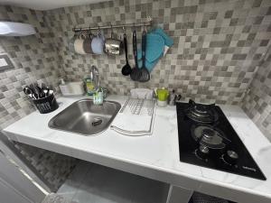 Kuchyňa alebo kuchynka v ubytovaní B&B House Napoli Cavour + 33 fotografií