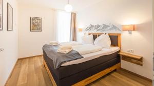 Voodi või voodid majutusasutuse Grimming Lodge by keyone toas