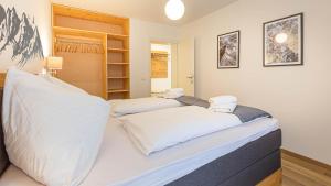 Voodi või voodid majutusasutuse Grimming Lodge by keyone toas