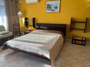 Giường trong phòng chung tại Agrihome di Alberto Giuseppe Gulotta - BELLA VISTA B&B - Chalet Marinaresco