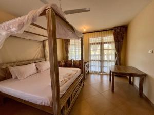 Postel nebo postele na pokoji v ubytování Jo's Baobab Luxury Apartments