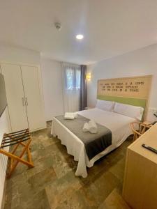 Postel nebo postele na pokoji v ubytování La Cilla, Hospedería Casa Molino