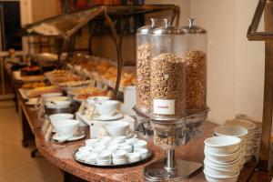 a long buffet of food on a table at Hotel Villa Michelon in Bento Gonçalves