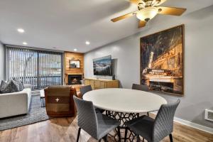 a living room with a table and chairs at Silvertown Condos by Park City Vacations in Park City