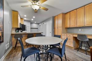 a kitchen and dining room with a table and chairs at Silvertown Condos by Park City Vacations in Park City