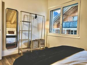 a bedroom with a bed and a window at Hidden Retreats The Lohner in Reichenbach
