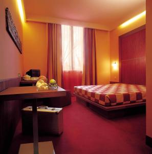 Tempat tidur dalam kamar di Methis Hotel & SPA
