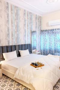 Postel nebo postele na pokoji v ubytování Viarch Stays - City Park At City Centre