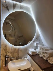 a bathroom with a sink and a mirror at Jahorina Green Chalet in Pale +59 photos