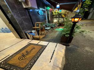 a welcome mat on the side of a building at GALATAGREENAPPLEHOTEL in Istanbul