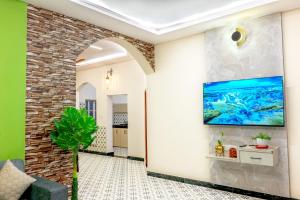 TV a/nebo společenská místnost v ubytování Viarch Stays - City Park At City Centre