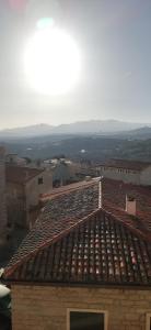 a roof of a building with a view of a city at La casa di DELFA in piazzetta in Aggius
