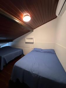 Postel nebo postele na pokoji v ubytování Gravata Apartamento Winterville + 31 fotografií