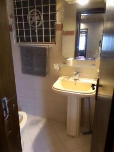 a bathroom with a sink and a mirror and a toilet at AK Homes in Rāwāt +10 photos