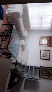 a stairway with towels on a shelf and a window at Hussein accommodation in Cape Town