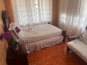 a small bedroom with a bed and a window at Cabana Playa Santa Apto C Piscinas Solar Energy in Guanica +30 photos
