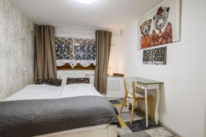 Posteľ alebo postele v izbe v ubytovaní APARTAMENT TAJEMNICZY OGRÓD ŚCISŁE CENTRUM ZAKOPANE